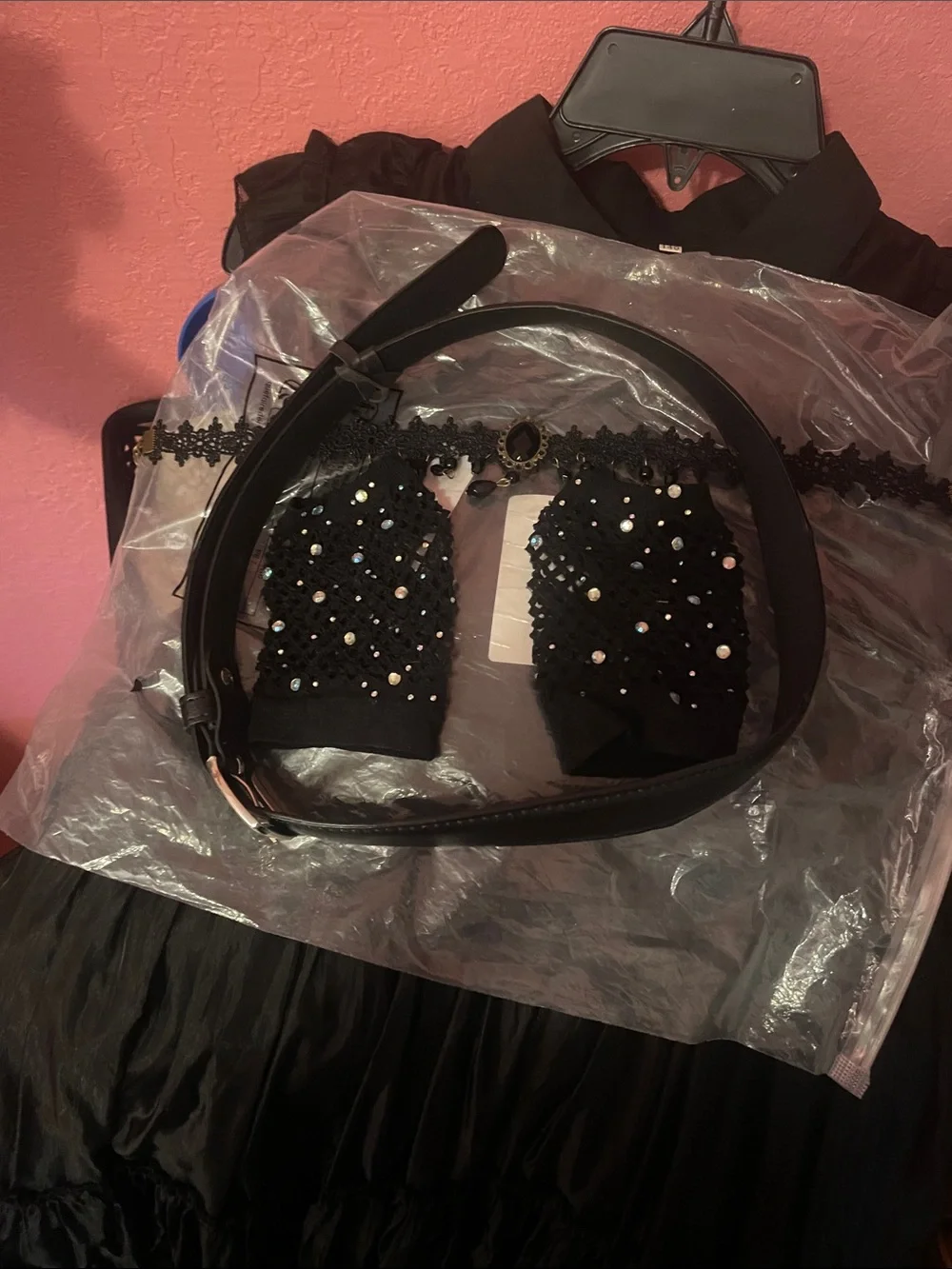 Wednesday black ruffle dress with gloves, choker necklace, and waist belt
